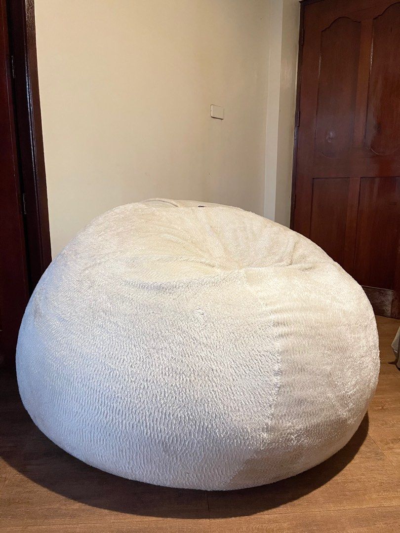 Giant beanbag sofa (Category: Sofas) located in Silang. Submitted by girlyouneedthis (Listing ID 1219660468, Image 2). Description: Original price 45k, now for only 28k, with lining, inclusions are 1 cream furr cover, 1 cream suede cover, and 1 black velvet cover. This is super steal! And super huge! Just needs some dry cleaning. .