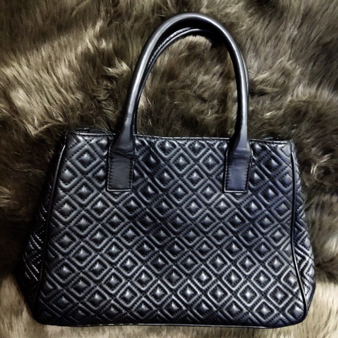 Tory Burch Marion Quilted Tote Bag (Category: Luxury Bags & Wallets) located in Manila. Submitted by shopaholic_gurl (Listing ID 1138397200, Image 3). Description: in excellent like new condition no flaws black leather material worn as hand or shoulder bag clean interior.