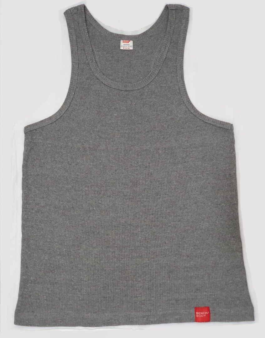 Bench Body Men's Undershirt (Category: Sleep and Loungewear) located in Paranaque City. Submitted by fcdm_olsell (Listing ID 1223953749, Image 2). Description: - Brand: Bench Body - 100% Authentic - Size: M on tag - Width (Body/Chest): 16.5 inches * Good for up to 32 inches waistline - Length (Shoulder to Bottom): 24.5 inches * Good for up to 5'8" tall - Material: 60% Combed Cotton, 40% Polyester - Color: Gray (See Photos) - Condition: Like New (
