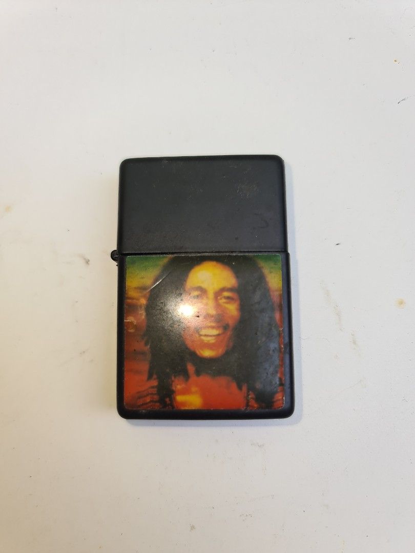 Bob Marley Zippo type lighter (Category: Vintage Collectibles) located in Makati City. Submitted by harvesting_game (Listing ID 1223946832, Image 2). Description: Bob Marley Zippo-type lighter. A collectible item or may be conversation piece and something to remind you about love and peace! Works..but never used..