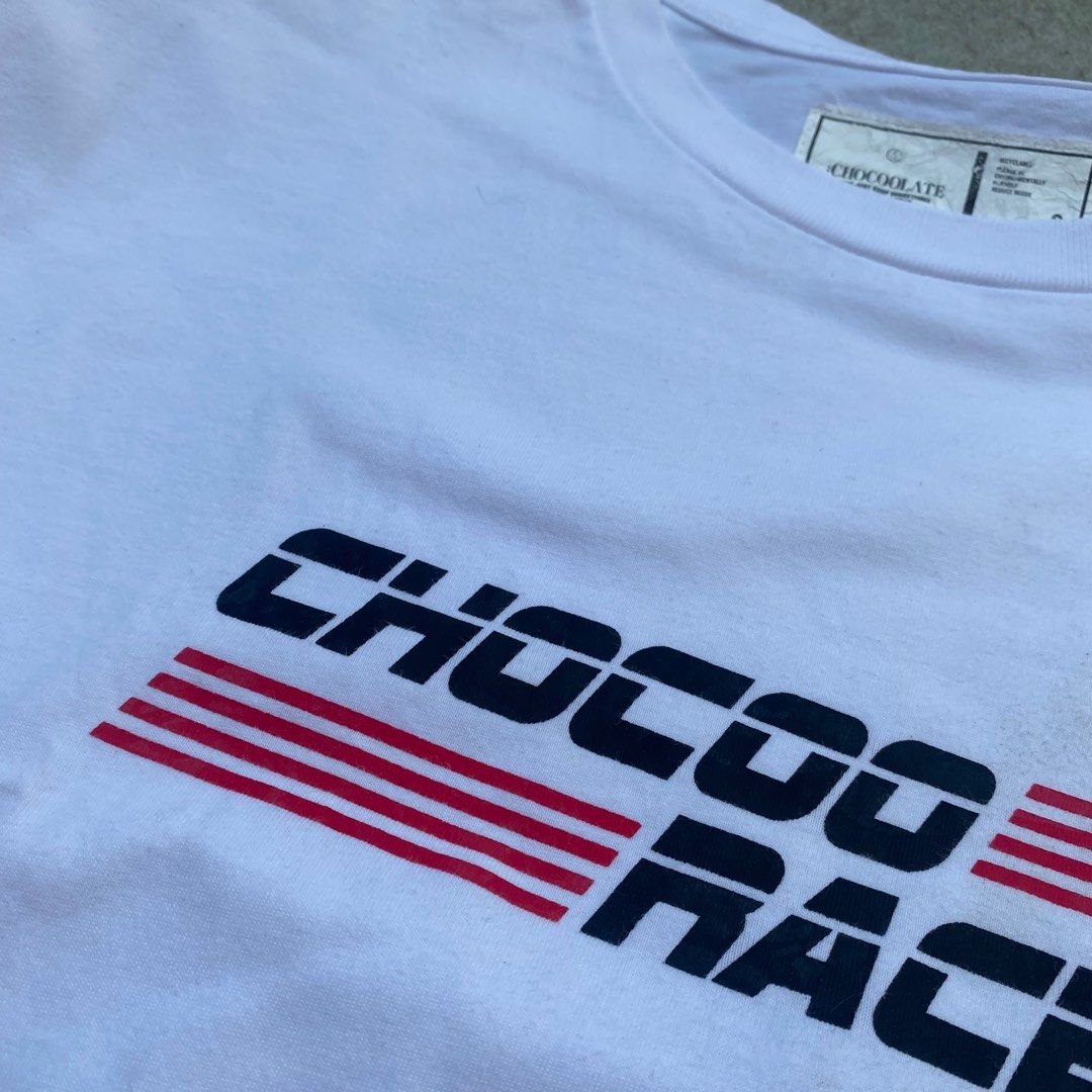 Chocoo Racer Basic White Graphic Shirt (Category: Tshirts & Polo Shirts ) located in Taytay. Submitted by cool.cat8 (Listing ID 1224118092, Image 3). Description: CHOCOOLATE GRAPHIC TEE ✷ SHOULER WIDTH: 21" ✷ PIT-TO-PIT WIDTH: 19.5" ✷ LENGTH: 26.5" MOP: GCASH/MAYA/BANK TRANSFER MOD: SHOPEE CHECKOUT/J&T EXPRESS .