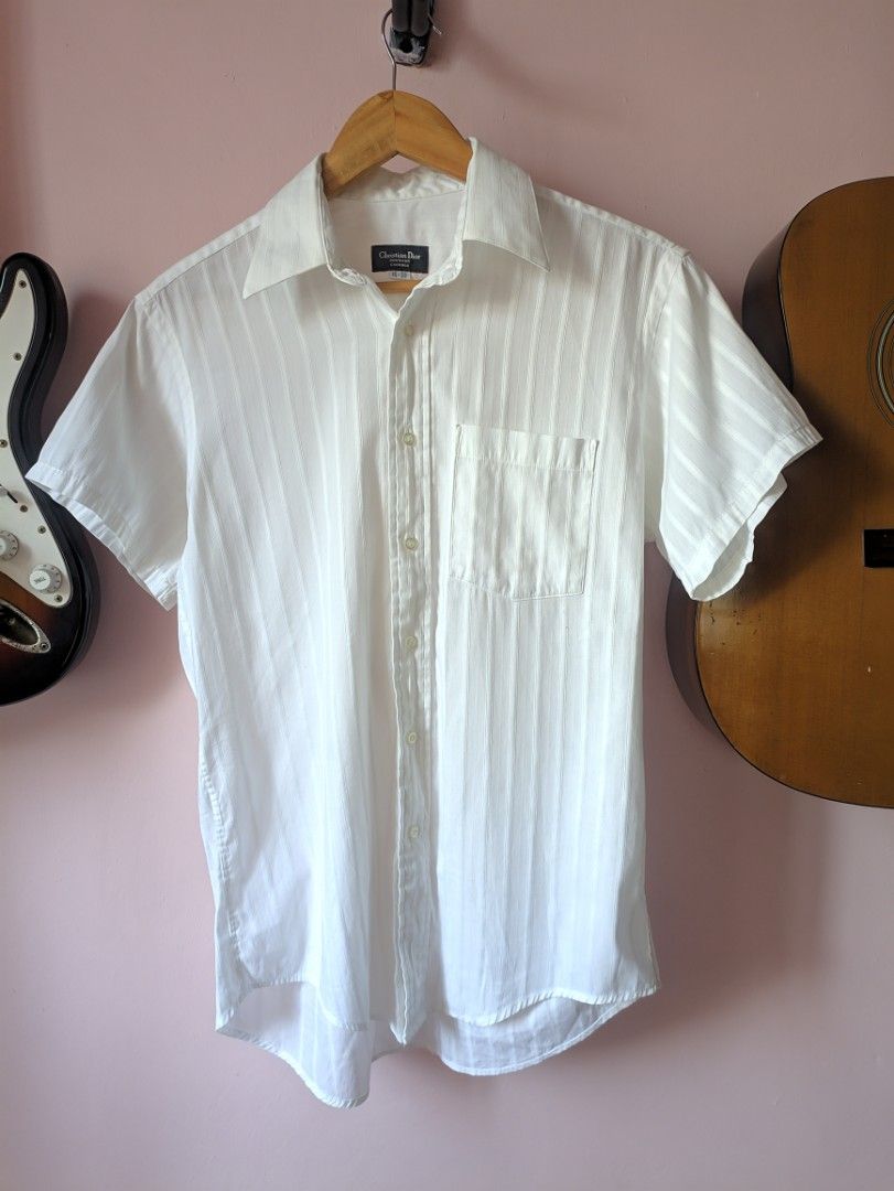 Christian Dior white polo (Category: Tshirts & Polo Shirts ) located in Taguig. Submitted by dropthatstuffph (Listing ID 1224035188, Image 2). Description: Size: no tag but fits M-L.