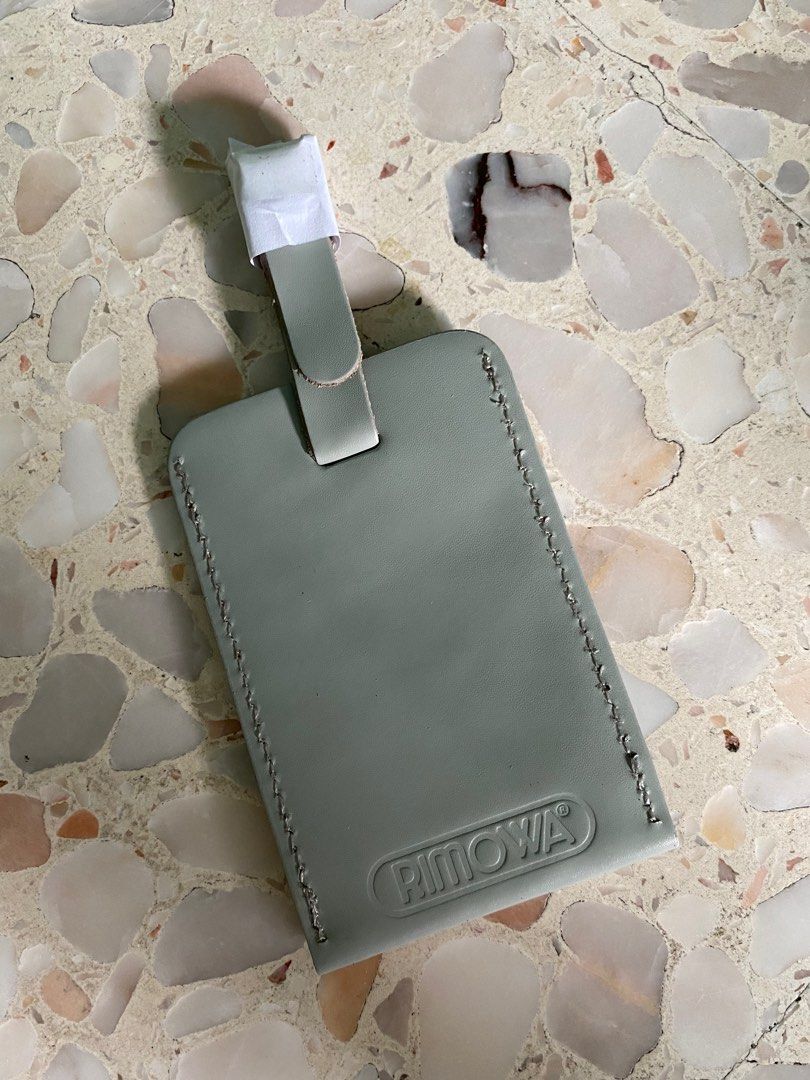 Rimowa luggage tag in grey, Hobbies & Toys, Travel, Travel Essentials