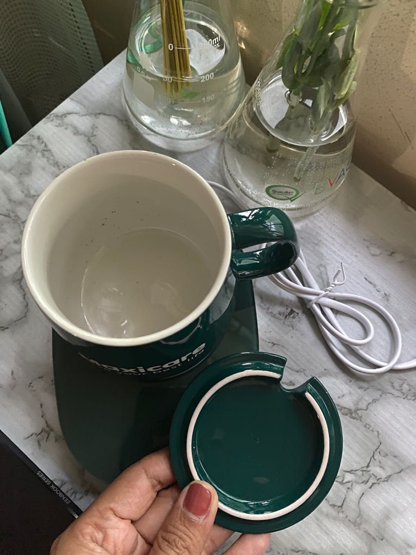 Ceramic Coffee Cup With Automatic Heating Pad/Coffee Warmer (Category: Coffee & Tea Tableware) located in Quezon City. Submitted by jeckmarj (Listing ID 1225764838, Image 3). Description: Ceramic Coffee Cup With Automatic Heating Pad/Coffee Warmer With box Includes: ceramic cup with cover, spoon and the heating pad.
