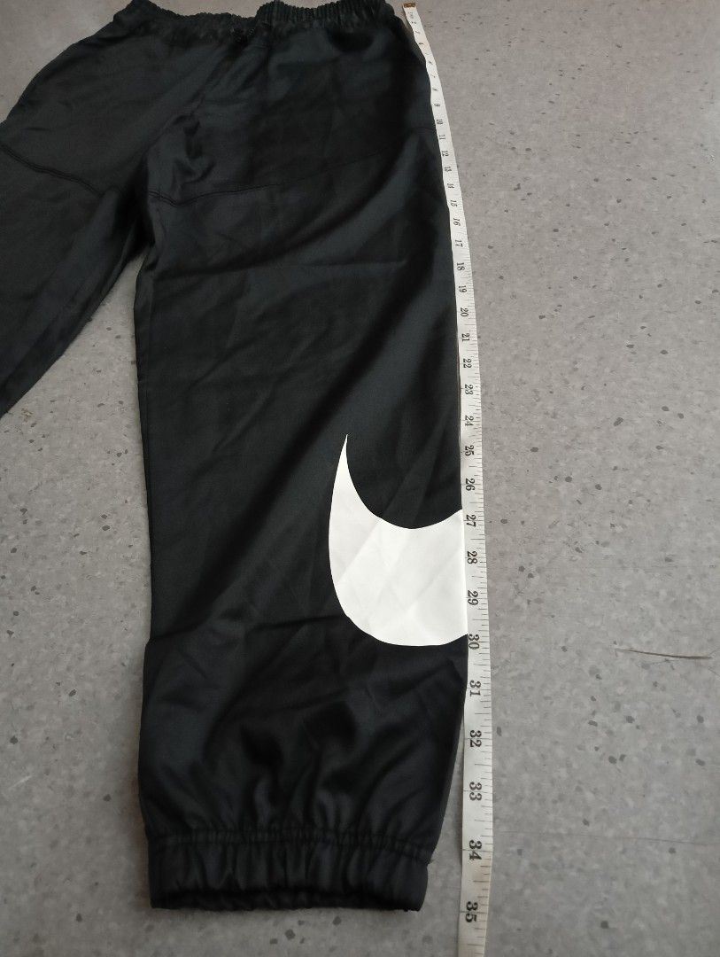 woven swoosh pants