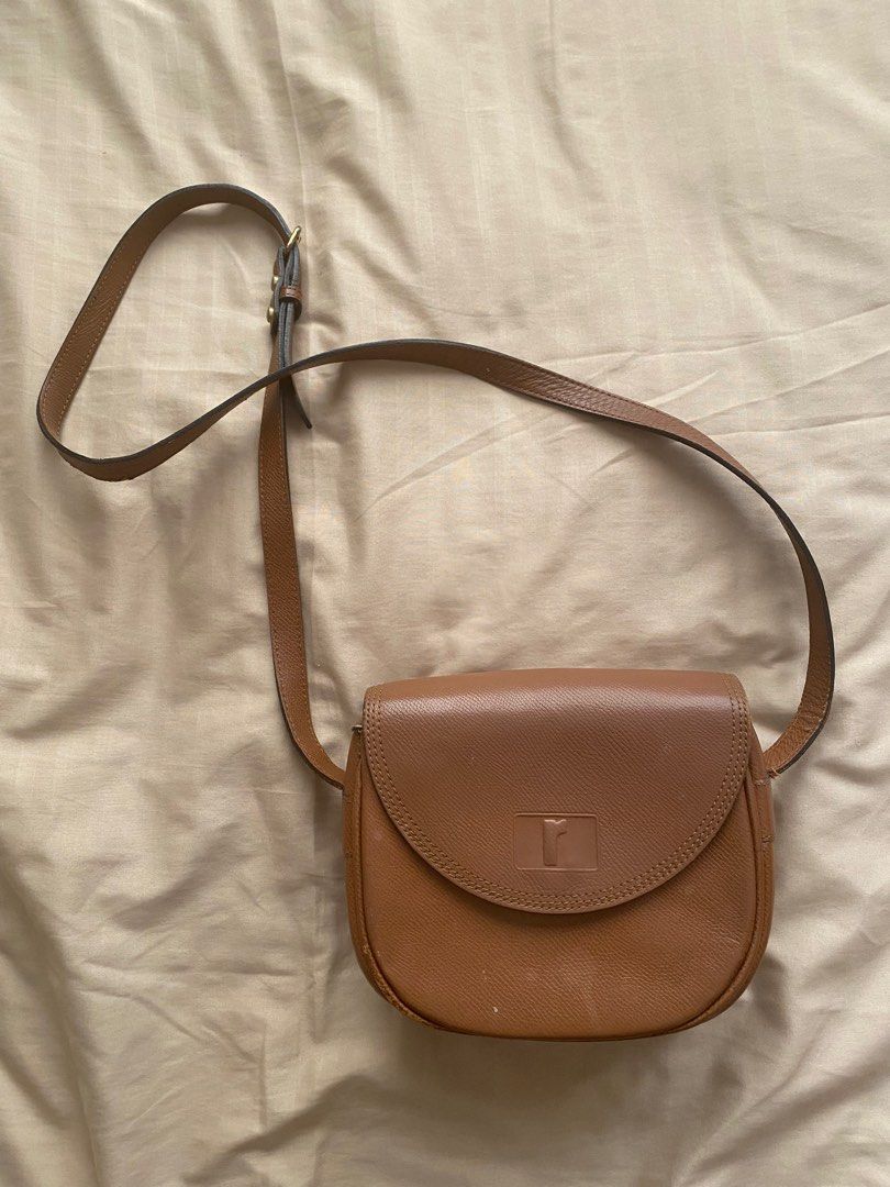 renoma brown saddle cross body bag (Category: Cross-body Bags) located in Cainta. Submitted by sanri0girl (Listing ID 1225804552, Image 1). Description: authentic brand! the flaws are fixable and the bag is still usable nonetheless :) a free bag comes with every purchase of any bag recently posted as well .