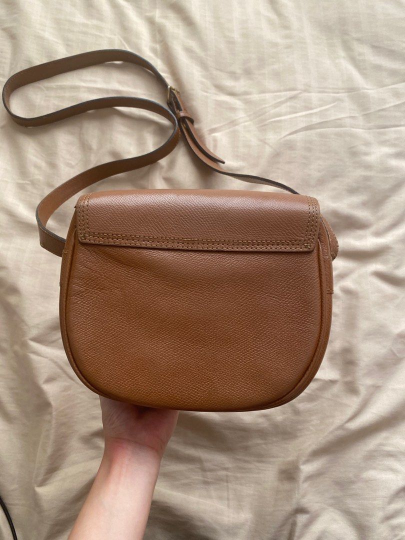 renoma brown saddle cross body bag (Category: Cross-body Bags) located in Cainta. Submitted by sanri0girl (Listing ID 1225804552, Image 2). Description: authentic brand! the flaws are fixable and the bag is still usable nonetheless :) a free bag comes with every purchase of any bag recently posted as well .