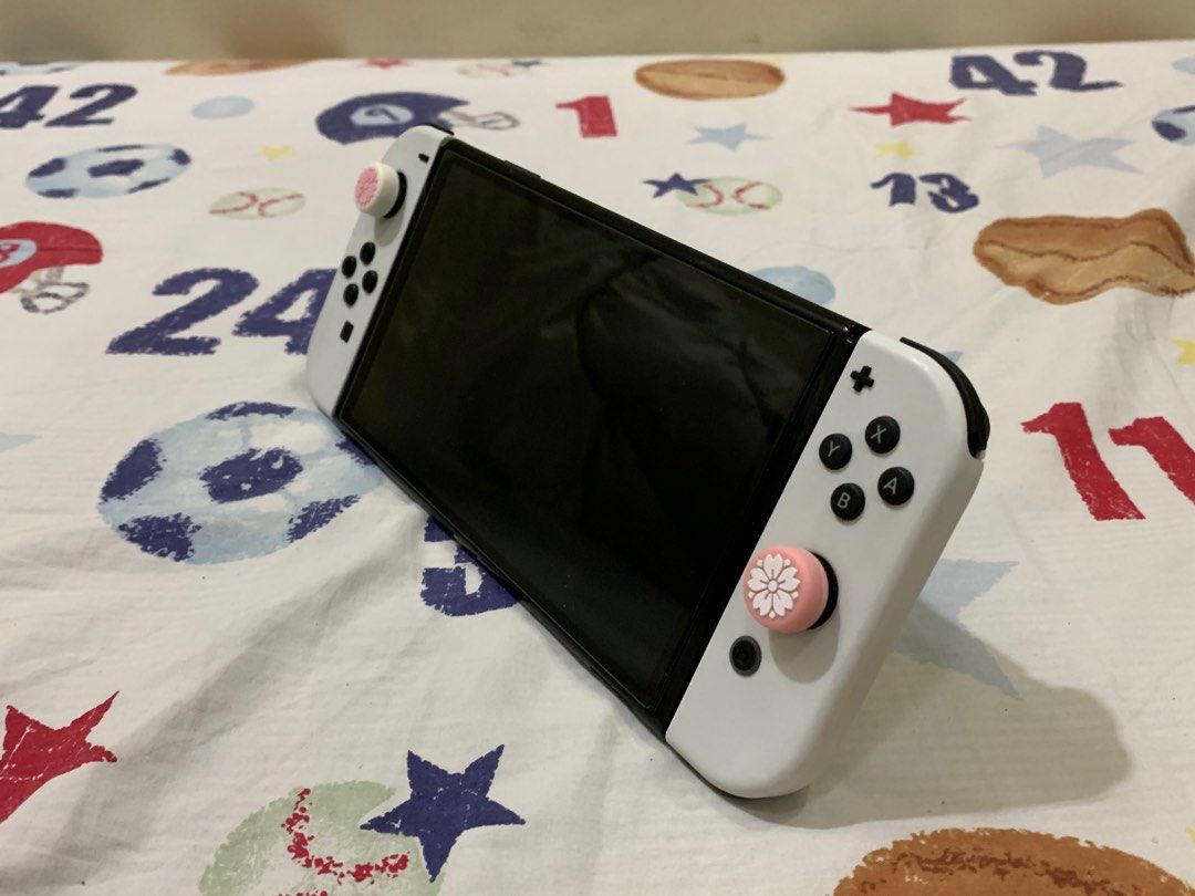 SWITCH OLED (Category: Nintendo) located in Porac. Submitted by b3rde.21xxx (Listing ID 1225828236, Image 3). Description: Good as new! Additional 2k para sa harvest moon na bala. Pass sa swap. Kung ano pong nakikita niyo sa picture yan lang yung kasama..