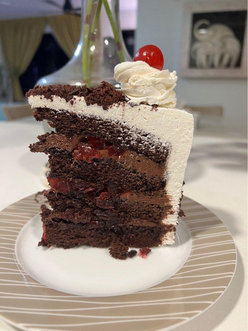 Black Forest cake (Category: Homemade Bakes) located in Singapore. Submitted by mojadesserts (Listing ID 1226087566, Image 2). Description: 4 layers of 8-inch size of Moist Chocolate sponge cake with a rich cherry filling, chocolate ganache , whip cream and creamcheese frosting as well as with cherries on top and decor with chocolate shaving. IMPORTANT PLEASE READ BEFORE ORDERING: Due to my work, I can only accept an order to be delivered on SATU