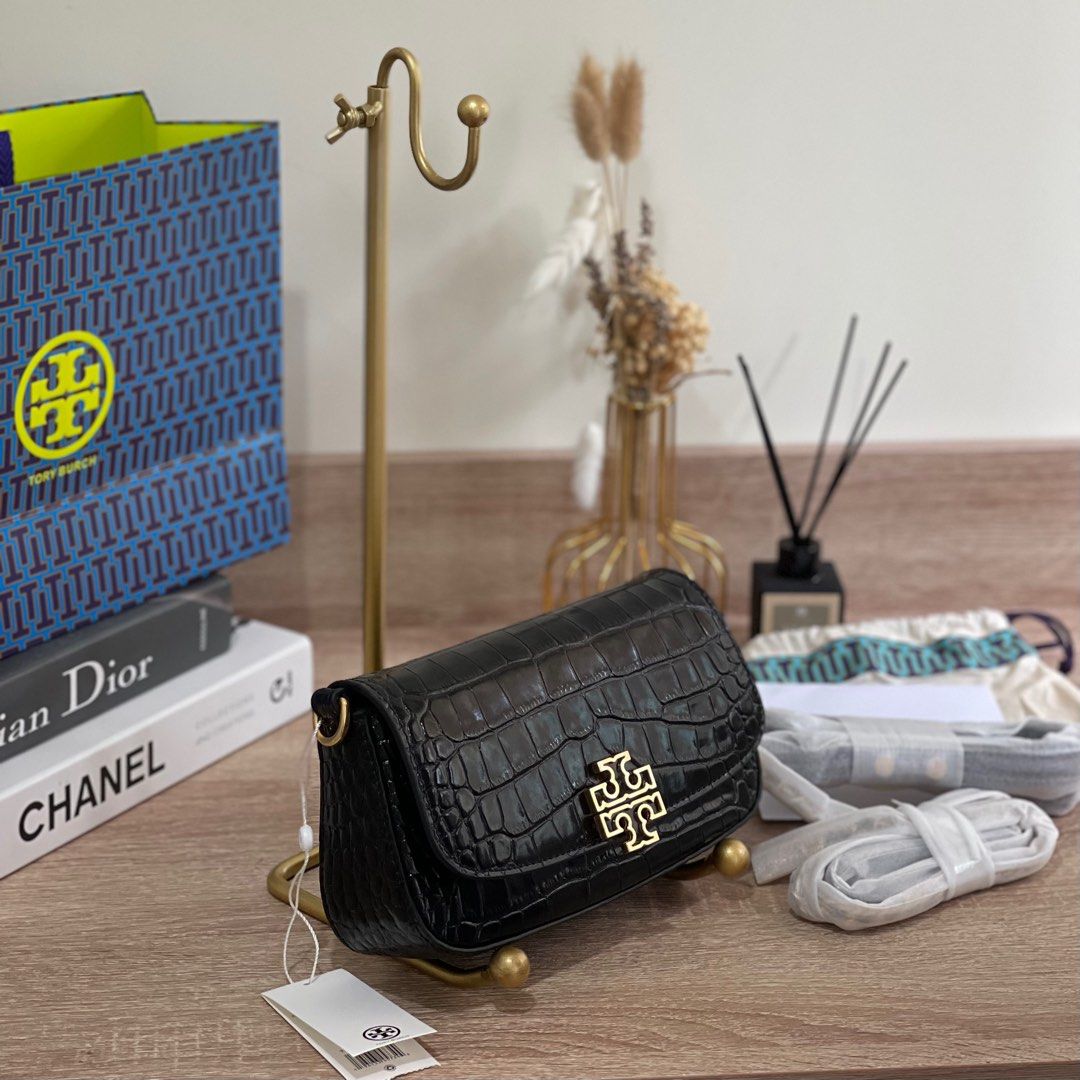 ON HAND: Tory Burch Britten Embossed Convertible Saddle Bag (Category: Cross-body Bags) located in Pasig City. Submitted by lizredclosetph (Listing ID 1225958180, Image 2). Description: ON HAND: Tory Burch Britten Embossed Convertible Saddle Bag Brandnew with complete inclusion.