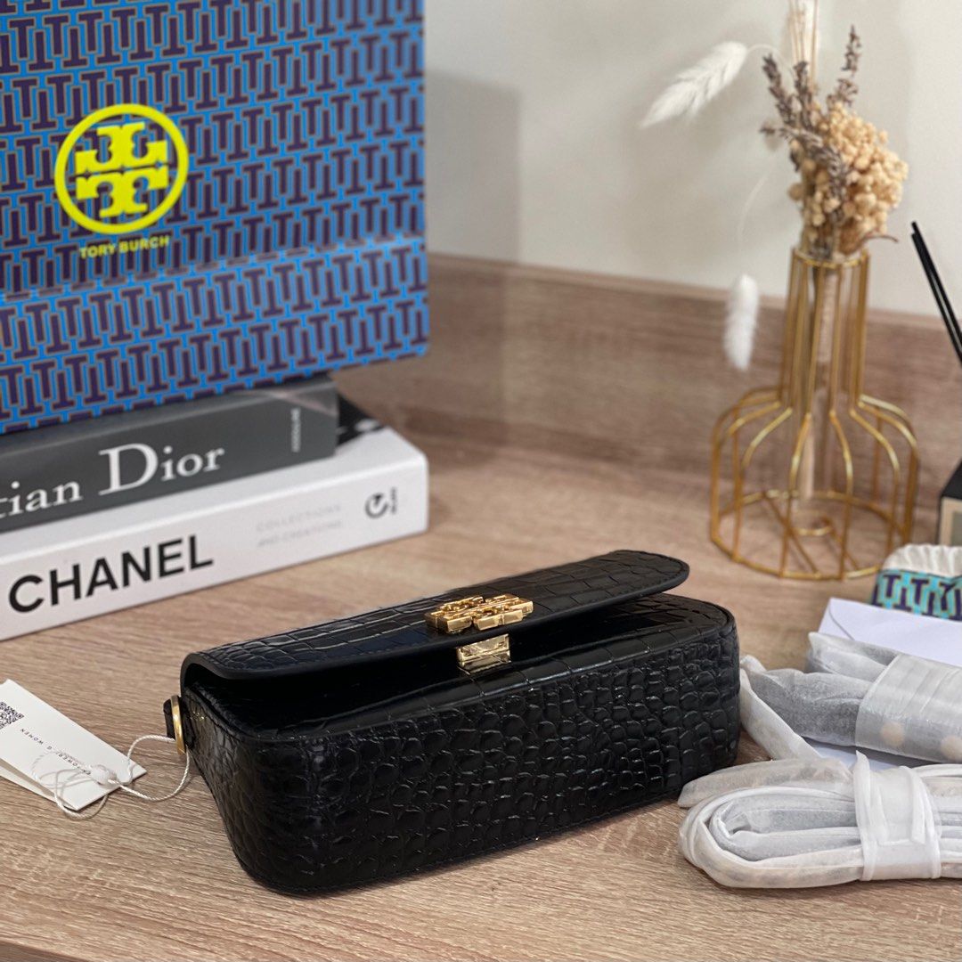 ON HAND: Tory Burch Britten Embossed Convertible Saddle Bag (Category: Cross-body Bags) located in Pasig City. Submitted by lizredclosetph (Listing ID 1225958180, Image 3). Description: ON HAND: Tory Burch Britten Embossed Convertible Saddle Bag Brandnew with complete inclusion.