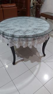 Wooden table with glass top