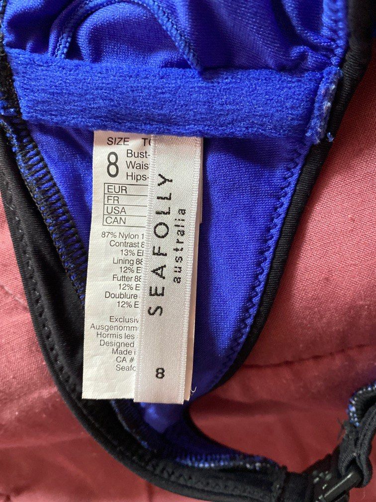 Blue and black tie around top (Category: Bikinis & Swimsuits) located in Quezon City. Submitted by leisdeclutter (Listing ID 1226145183, Image 3). Description: - bought from shopee live seller - used but not abused, this was my favorite top even if im not using it for swimming hehe - outgrown already - SIZES are on the picture .