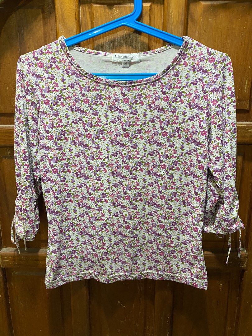 Christian Dior Top (Category: Shirts) located in Naga. Submitted by Reese13 (Listing ID 1226264985, Image 2). Description: Padala from US. Never used, na stock lang sa bahay. With minor issue as seen as pic ( na stock lang kasi kaya siguro nag kaganon) Pero overall okay na okay pa 💗 .
