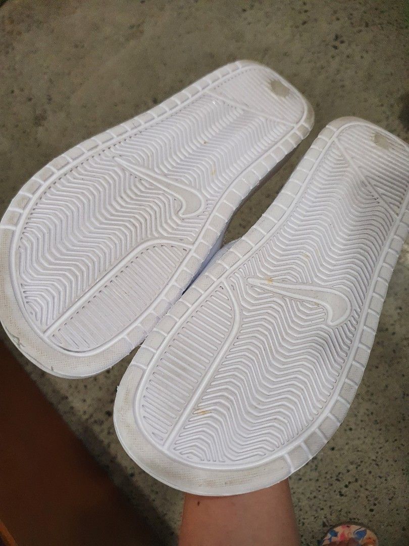 half black half white nike slides