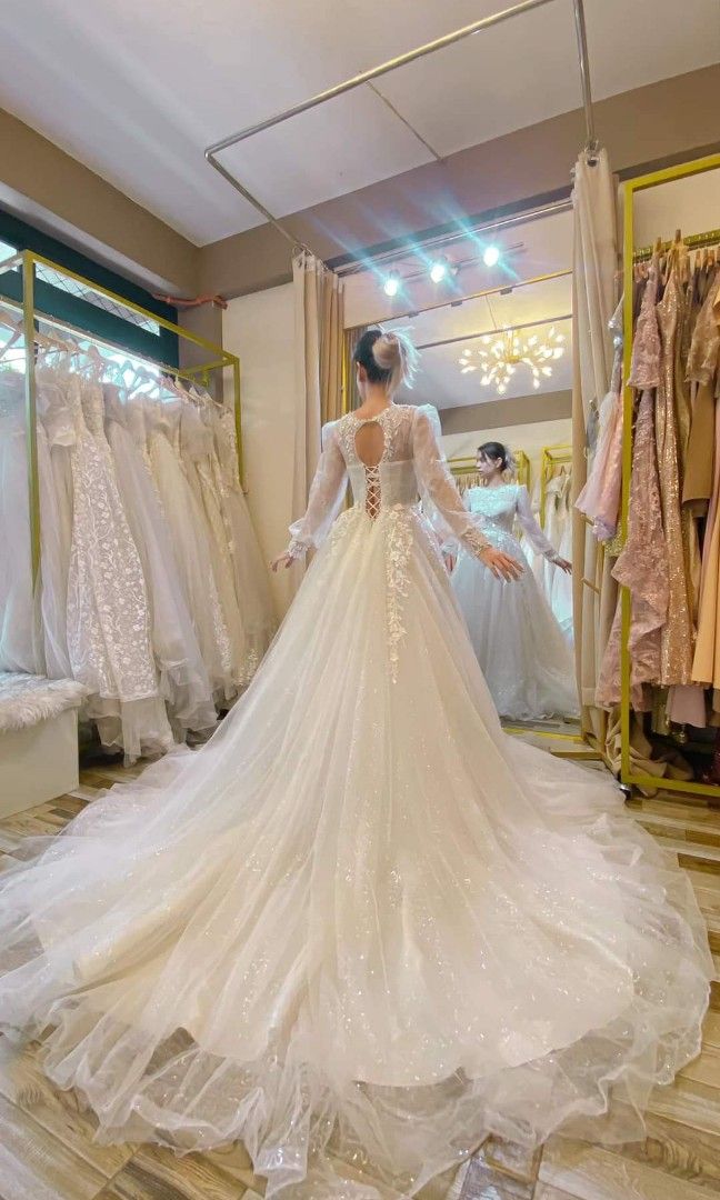 Longtrail Wedding gown with 3D flowers (Category: Evening dresses & gowns) located in Malolos. Submitted by sofideclutters (Listing ID 1226490380, Image 2). Description: Beautiful Longtrail Wedding gown with 3D flowers. Hoarded wedding gown but never used. I bought this because this looks like my mom's wedding church dress. However, never used. Bought in FB for 10K White color Preowned so expect slight sign of usage S-M, tho adjustable back Filip