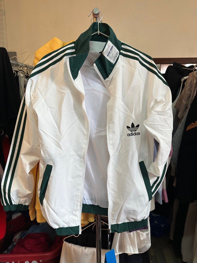 White adidas jacket with green stripe new arrivals