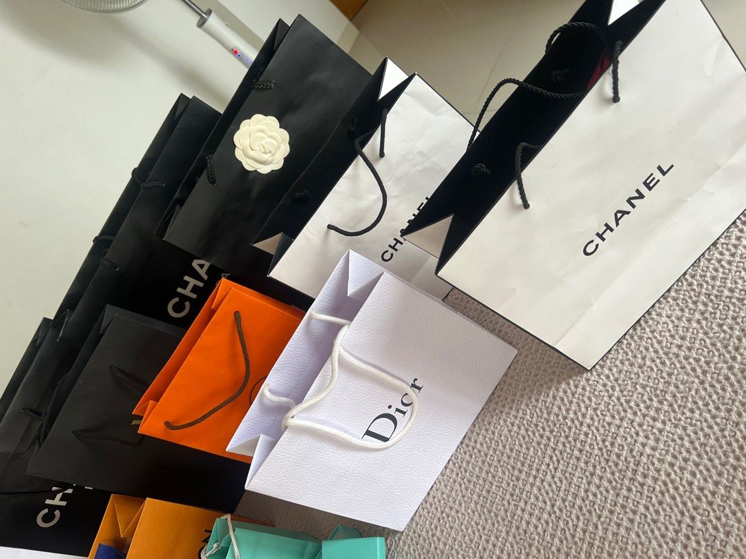 Paper bags (Category: Luxury Bags & Wallets) located in Pasig City. Submitted by lai08. (Listing ID 1226567772, Image 2). Description: Hi all! Im selling my paper bags collected during shopping😅 Won’t bringing them back abroad so maybe you guys might need it :) All 100% genuine Chanel with ribbons Hermes with ribbon Dior YSL Burberry LV tiffany Marc Jacobs Big once for only 800 Small 500 Thanks!.