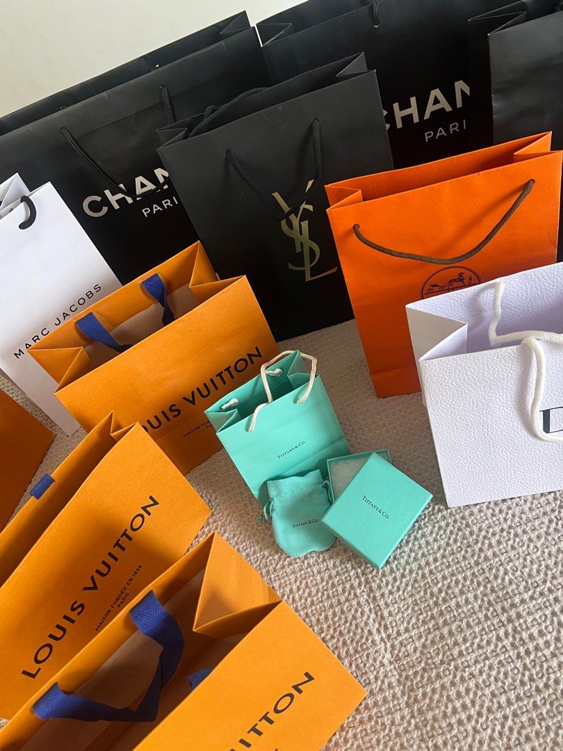 Paper bags (Category: Luxury Bags & Wallets) located in Pasig City. Submitted by lai08. (Listing ID 1226567772, Image 3). Description: Hi all! Im selling my paper bags collected during shopping😅 Won’t bringing them back abroad so maybe you guys might need it :) All 100% genuine Chanel with ribbons Hermes with ribbon Dior YSL Burberry LV tiffany Marc Jacobs Big once for only 800 Small 500 Thanks!.