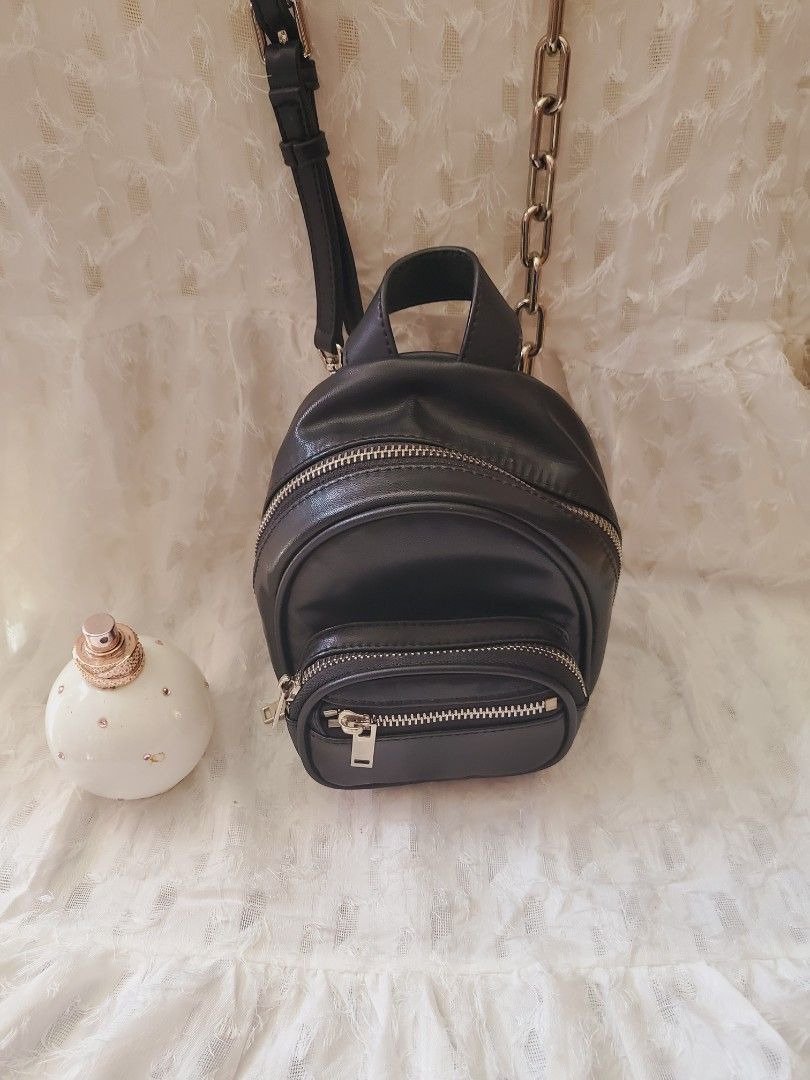 Black micro sling bag (Category: Luxury Bags & Wallets) located in Sogod. Submitted by silverriver_b6b903 (Listing ID 1226522189, Image 2). Description: Pwede backpack but no strap sling only super cute.