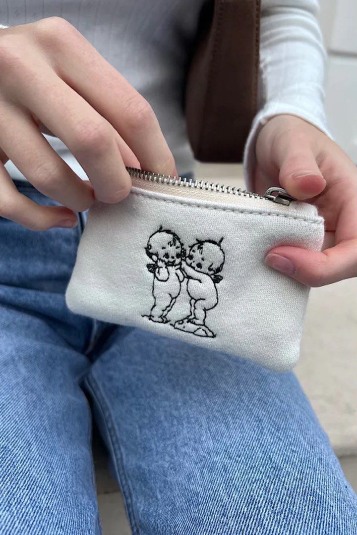 WTS hugging cherub babies coin purse brandy melville