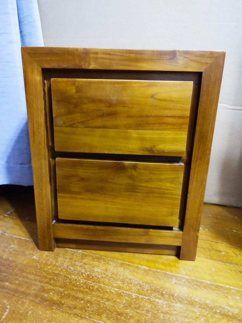 Bedside Table (Category: Shelves, Cabinets & Racks) located in Singapore. Submitted by lim_peggy (Listing ID 1226696471, Image 1). Description: 2-drawer, natural colour, solid teak wood bedside table 50x40x60(ht) cm at $150. Well polished interior/back side..