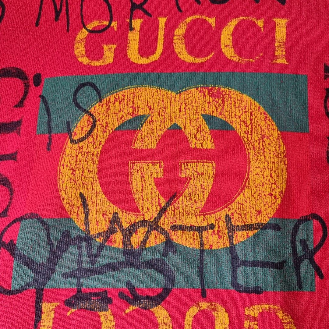 Gucci Red Distressed Sweatshirt / Sweater (Category: Luxury Apparel) located in Manila. Submitted by _moca01 (Listing ID 1226741438, Image 2). Description: GUARANTEED AUTHENTIC 💯 ▫️Red "Tomorrow Is Now Yesterday" Big Logo Printed Distressed Oversized Sweatshirt -USED, in good condition. Ready to use. - Color rate (7.5/10), idk if it's really designed as this since it distressed -Distressed design, OVERSIZED fit in women’s. Model is 5”2 and usual