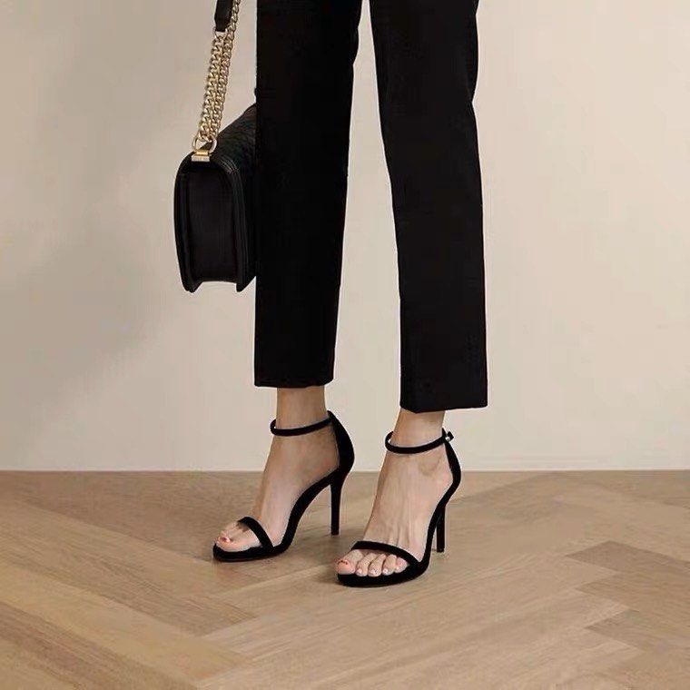 One strap deals black heels