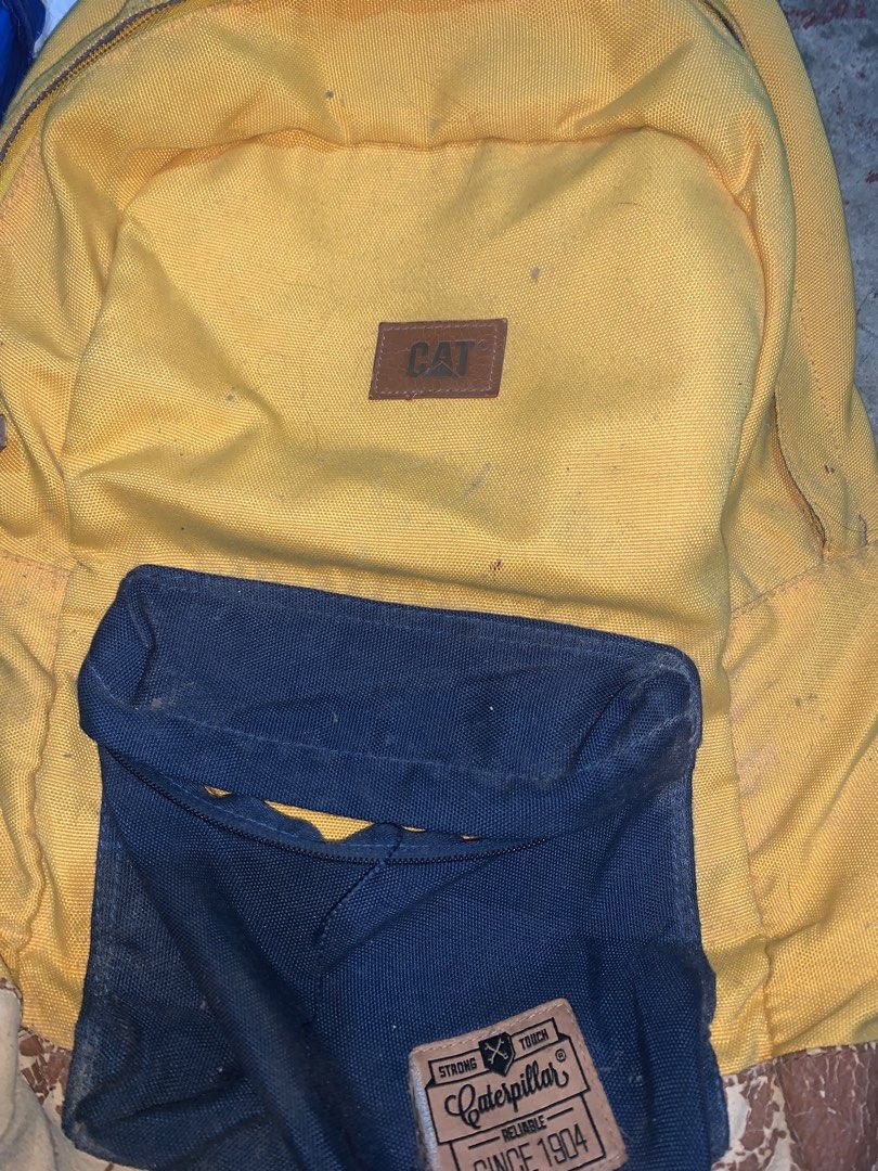Original CAT Backpack (Category: Backpacks) located in San Mateo. Submitted by gypcccx (Listing ID 1226800765, Image 1). Description: Selling Original CAT Backpack in Yellow. -No zipper in front pocket. -Working zipper for main compartment. - No inside backpack flaws - See pictures for outside flaws..