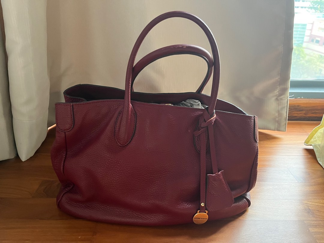 Maroon colour bag store