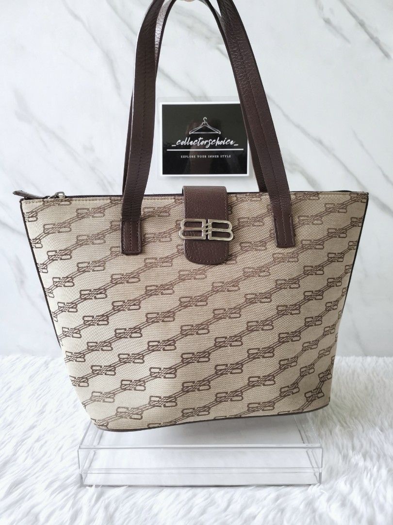 Authentic Balenciaga Vintage Monogram Bag (Category: Luxury Bags & Wallets) located in Makati City. Submitted by _collectorschoice_ (Listing ID 1226986004, Image 2). Description: ° BB clasp shoulder bag ° Monogram BB canvas ° Leather trim & straps ° Silver plated hardware ° Balenciaga embossed on leather trim ° Exterior pocket, interior pocket ° Never used ° Minor washable dirt on canvas (not noticeable) ° MOP: BPI or Unionbank ° Plus shipping fe