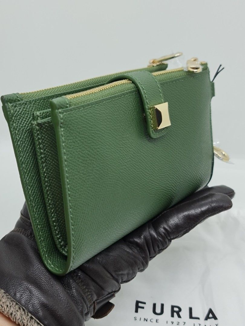 Authentic Furla Wristlet Green (Category: Luxury Bags & Wallets) located in Binan City. Submitted by mommysellsph (Listing ID 1227007441, Image 2). Description: Brand new from UK Has an inner compartment for mobile phones Includes credit card slots.