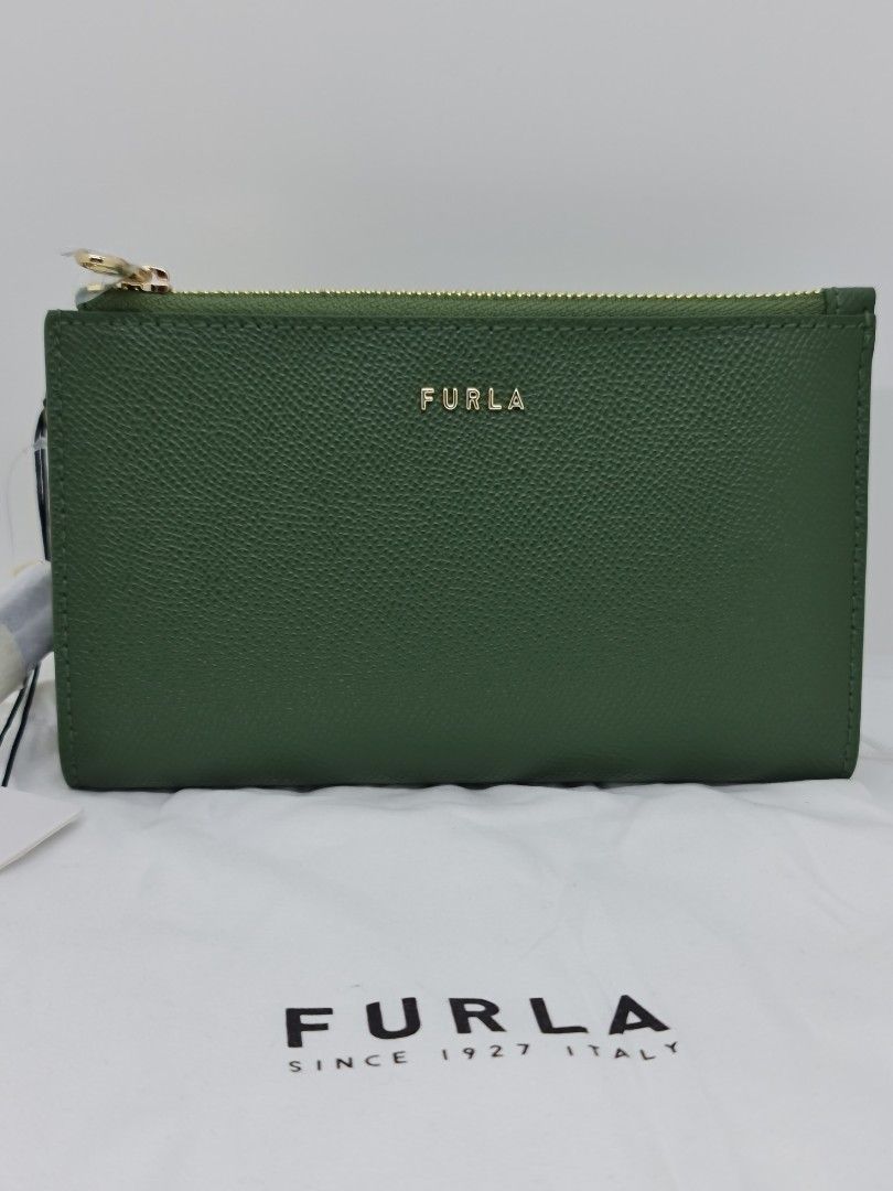 Authentic Furla Wristlet Green (Category: Luxury Bags & Wallets) located in Binan City. Submitted by mommysellsph (Listing ID 1227007441, Image 1). Description: Brand new from UK Has an inner compartment for mobile phones Includes credit card slots.