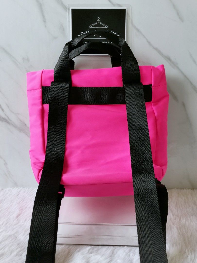 Kendall + Kylie Textured 2 Way Bag (Category: Luxury Bags & Wallets) located in Makati City. Submitted by _collectorschoice_ (Listing ID 1226998040, Image 3). Description: ° Two-way bag (handbag or backpack) ° Closure type: Exterior rope details ° Composition: Neoprene ° Color: Neon pink/black ° Kendall + Kylie rubber puller ° Adjustable strap ° Two handles ° Never used ° MOP: BPI or Unionbank ° Plus shipping fee ° Courier: JRS only (home pick up