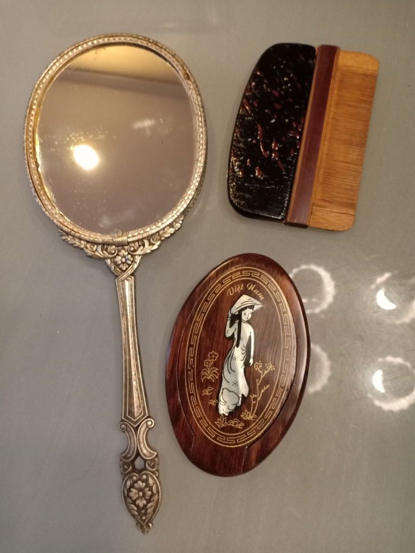 Vintage Mirror & Comb (Category: Mirrors) located in Binangonan. Submitted by stufflikedat (Listing ID 1227004032, Image 1). Description: Vintage Japanese 1961 Shiseido Hanatsubaki Club hand mirror in very good condition silver color all metal with marking, very nice patina no crack on the mirror for 1k Vintage Double sided comb (suyod) made of bamboo with lacquered wooden handle in excellent condition no defect for 700 Vintage purse/pocket foldi