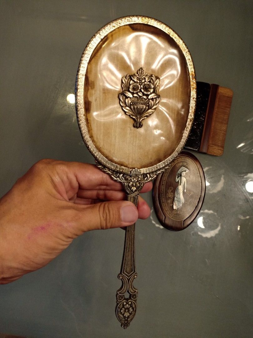 Vintage Mirror & Comb (Category: Mirrors) located in Binangonan. Submitted by stufflikedat (Listing ID 1227004032, Image 3). Description: Vintage Japanese 1961 Shiseido Hanatsubaki Club hand mirror in very good condition silver color all metal with marking, very nice patina no crack on the mirror for 1k Vintage Double sided comb (suyod) made of bamboo with lacquered wooden handle in excellent condition no defect for 700 Vintage purse/pocket foldi