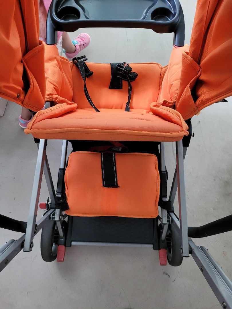 Joovy double store stroller orange