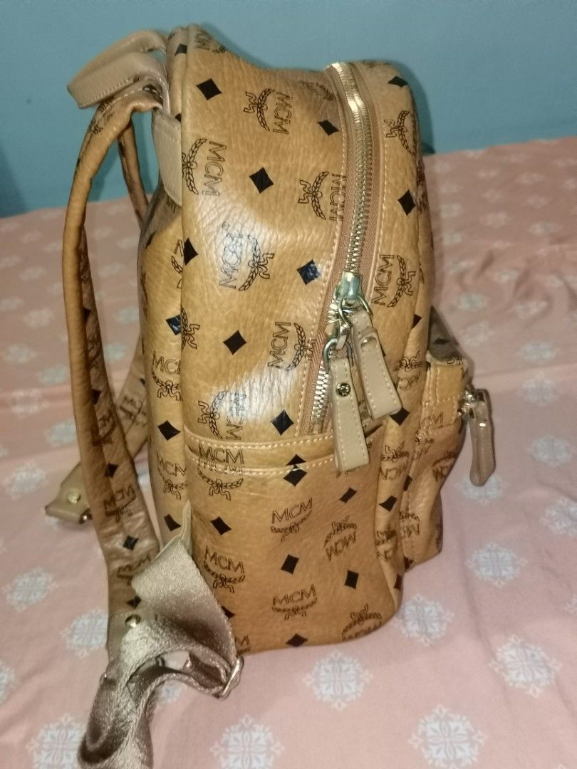 Authentic MCM cognac medium backpack (Category: Luxury Bags & Wallets) located in Dinalupihan. Submitted by hydzsalva (Listing ID 1227360426, Image 3). Description: Selling my original MCM medium backpack cognac. Has minor discoloration on top near handle. edges and inside are ok and no flaws..