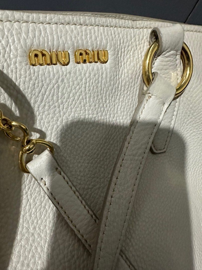 Miu Miu (Authentic) (Category: Luxury Bags & Wallets) located in Quezon City. Submitted by seriliz (Listing ID 1227358721, Image 3). Description: Original preloved Miu Miu bag with signs of use but hardwares are gold, no leather cracks Two way (hand held or may be used with strap).