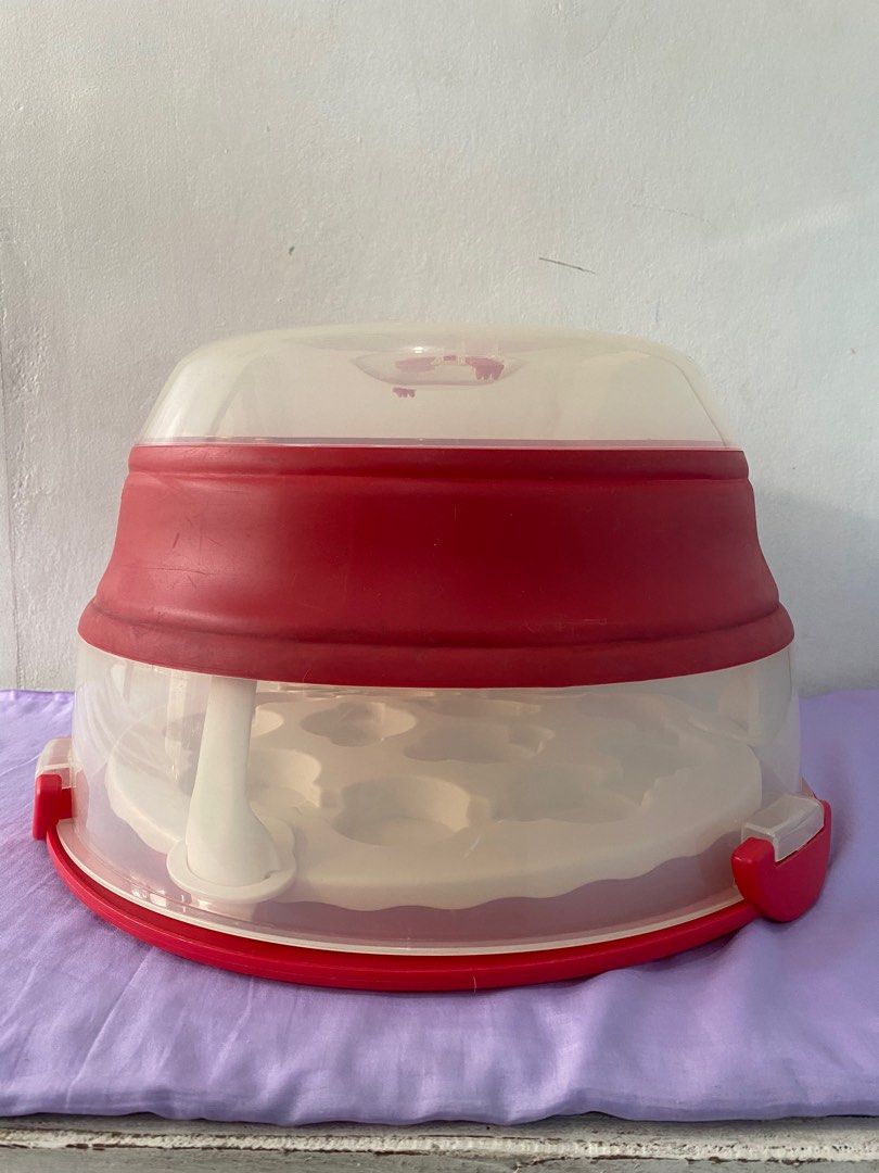 Progressive Collapsible Cupcake/ Cake Carrier (Category: Bakeware) located in Quezon City. Submitted by bearlilits_closet (Listing ID 1227377723, Image 1). Description: Bought in US. Used twice only then tinago na. A bit of cleaning needed sa labas. In good condition. Pick up in Novaliches,QC RFS: Migrating,so nagbabawas ng gamit. Description: Easily transport tasty treats to any party! The Collapsible Cupcake and Cake Carrier holds up to 24 cupc