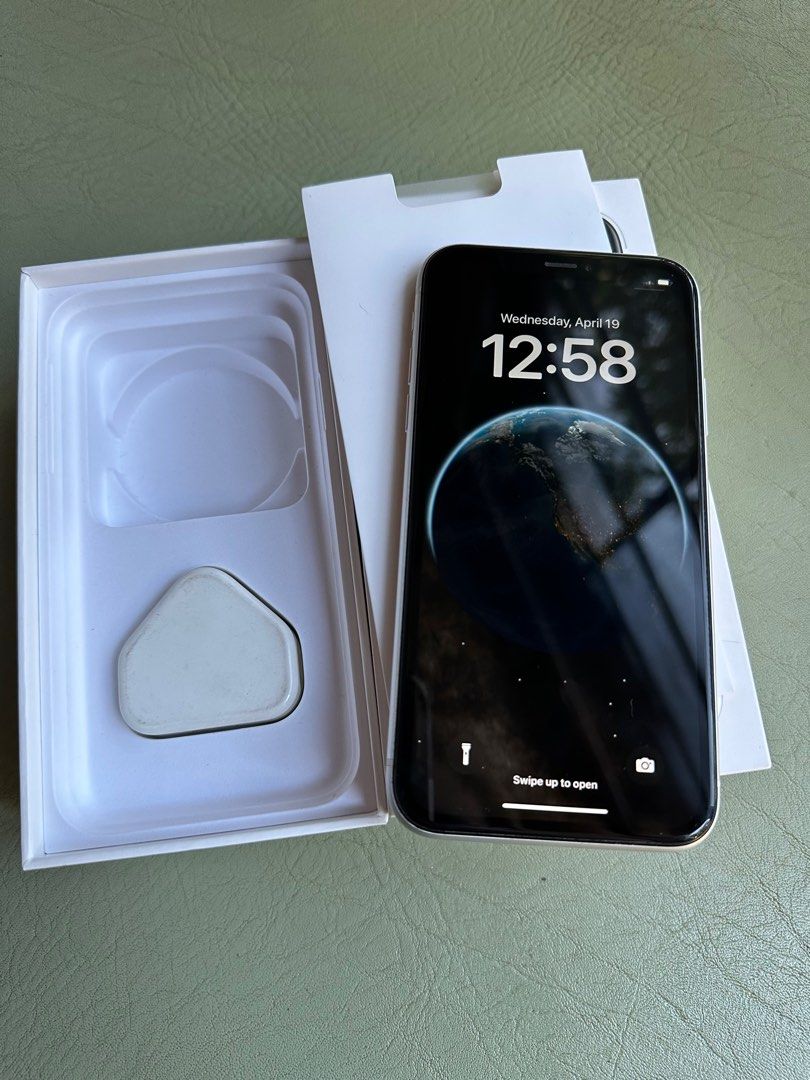 iPhone XR 64GB (Openline) (Category: iPhone X Series) located in Quezon City. Submitted by caraousells (Listing ID 1227517258, Image 1). Description: Iphone XR White - 64GB - Openline/Factory unlocked - Esim capable Current condition: - 81% battery life - All original parts (never replaced/repaired) - iOS 16 Issues: - Minor dents on lower sides - Small screen flare as seen on photo (not seen if in dark mode) Inclusions: - Original box - UK chargi