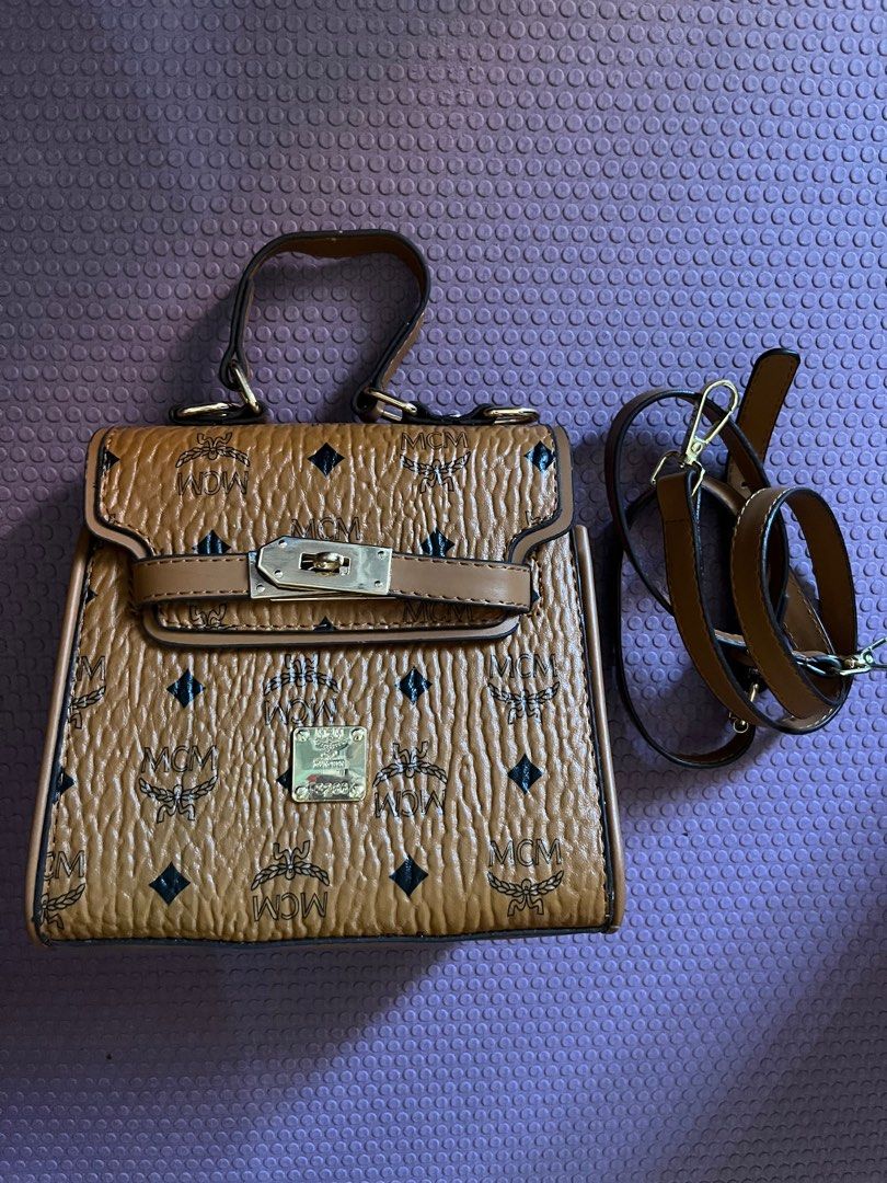 MCM heritage mini kelly satchel bag (Category: Cross-body Bags) located in Antipolo. Submitted by mancstan20 (Listing ID 1227584745, Image 2). Description: no flaws strap included not sure of authenticity.