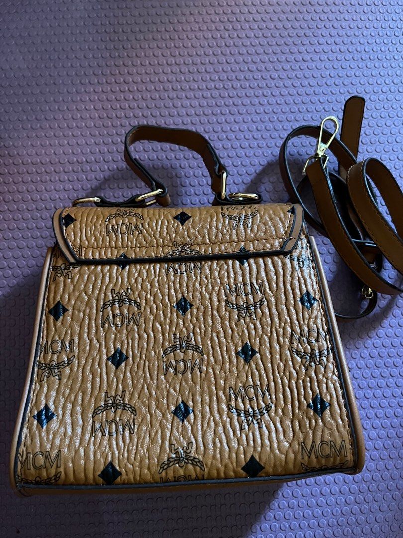 MCM heritage mini kelly satchel bag (Category: Cross-body Bags) located in Antipolo. Submitted by mancstan20 (Listing ID 1227584745, Image 3). Description: no flaws strap included not sure of authenticity.
