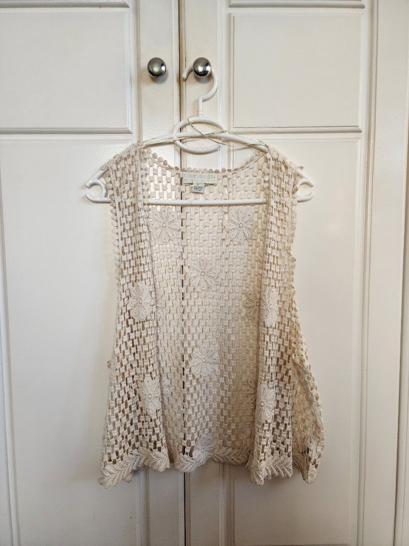 Forever 21 Summer Crochet Vest (Category: Others Tops) located in Paranaque City. Submitted by hannahsrm (Listing ID 1224193119, Image 1). Description: Forever 21 crochet vest ◇ Sleeveless open knit top ◇ Can be used as beach and swimsuit cover-up ◇ Good for layering! Lightweight, makes it summer and heat friendly ◇ Has minor aging stains (see photos) but is barely noticeable when worn! SIZE: XL on tag.