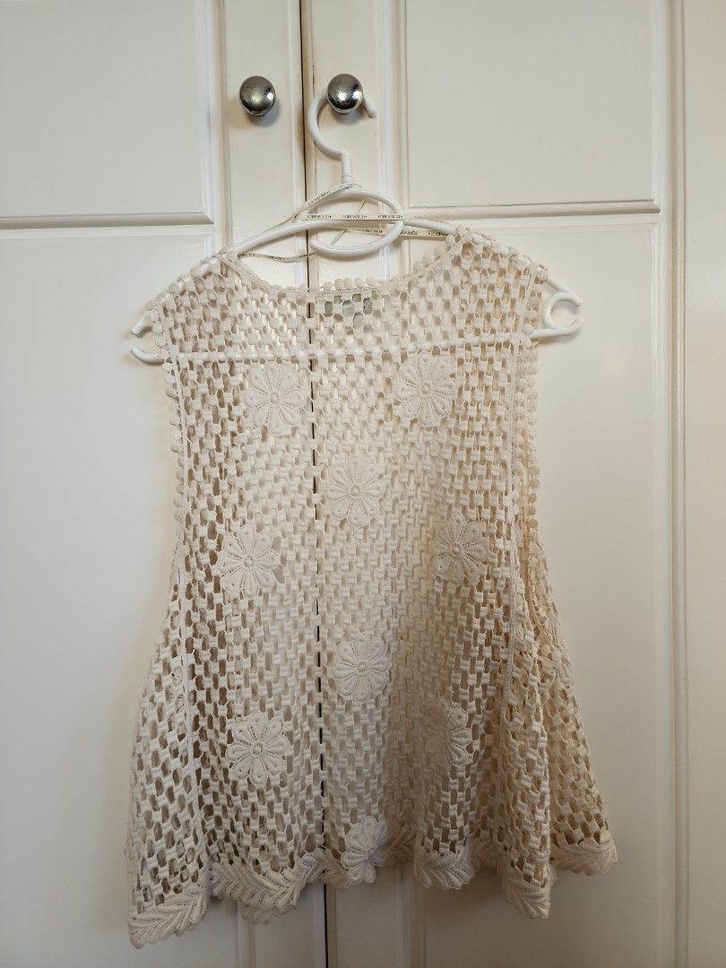 Forever 21 Summer Crochet Vest (Category: Others Tops) located in Paranaque City. Submitted by hannahsrm (Listing ID 1224193119, Image 2). Description: Forever 21 crochet vest ◇ Sleeveless open knit top ◇ Can be used as beach and swimsuit cover-up ◇ Good for layering! Lightweight, makes it summer and heat friendly ◇ Has minor aging stains (see photos) but is barely noticeable when worn! SIZE: XL on tag.