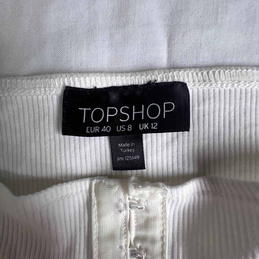 Original TOPSHOP Off Shoulder Top - White (Category: Blouses) located in Imus. Submitted by adc007 (Listing ID 1224217939, Image 2). Description: 💯 Original ✅ Pre-loved ✅ Good Condition ✅ Negotiable for sure buyer ➡️ 100 php Brand: Topshop Shoulder Width: 17 in Width: 15 in Height: 12.5 in Message me for more pictures or for further inquiries. Would love to have my pre-loved items find a new home. Cheers!.