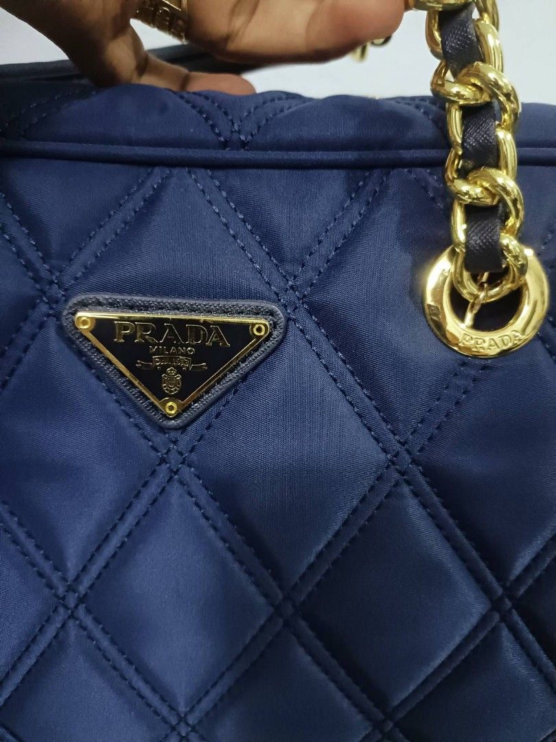 Preloved Prada tesuto (Category: Luxury Bags & Wallets) located in Cebu City. Submitted by day.98 (Listing ID 1224147655, Image 2). Description: selected from japan surplus nailon type dark navy blue color mm size lampo zipped no flaws with dust bag.