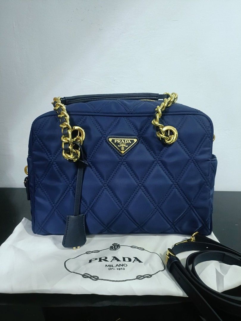Preloved Prada tesuto (Category: Luxury Bags & Wallets) located in Cebu City. Submitted by day.98 (Listing ID 1224147655, Image 1). Description: selected from japan surplus nailon type dark navy blue color mm size lampo zipped no flaws with dust bag.