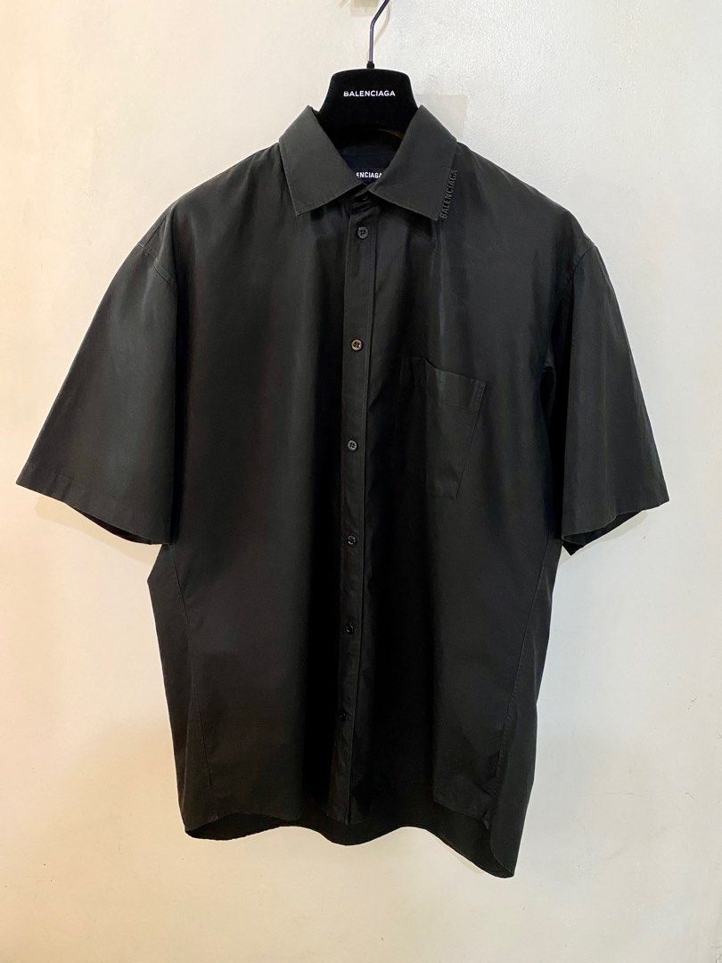 Balenciaga Black Shirt (Category: Luxury Apparel) located in Pasig City. Submitted by capsulecollection (Listing ID 1227598286, Image 3). Description: Balenciaga coated cotton black button down shirt Rubber logo on one side of the collar Boxy fit, wide shoulder .