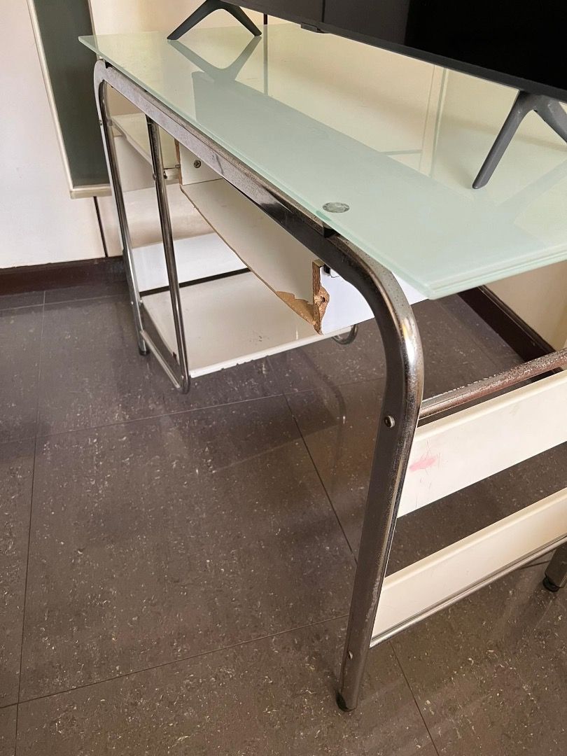 Office Computer Table (Category: Office Furniture & Fixtures) located in Caloocan City. Submitted by rubywednesdays (Listing ID 1227682684, Image 2). Description: FOR SALE: Computer Table / Office Table SIZE: 108cm Width 50cm Depth 76cm Height CONDITION: Used but in working condition; issues on drawer, bars and shelf parts as seen in photos MATERIAL: Mixed - Glass, Metal, Wood PICK UP: Sta. Rosa, Laguna PRICE: Negotiable.